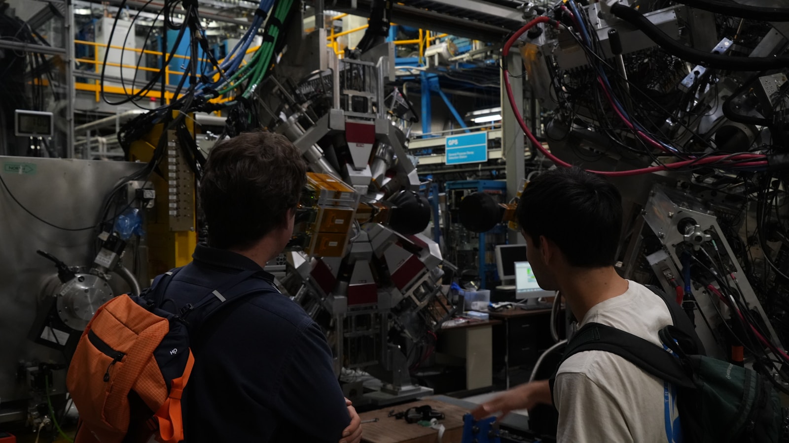Researchers collaborating around advanced scientific equipment